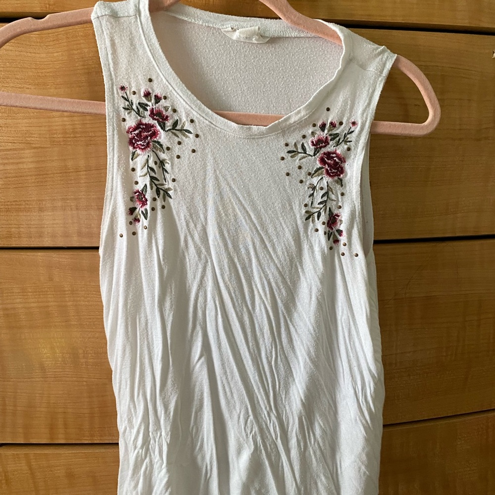Worn 2  times. It will come washed and ironed.